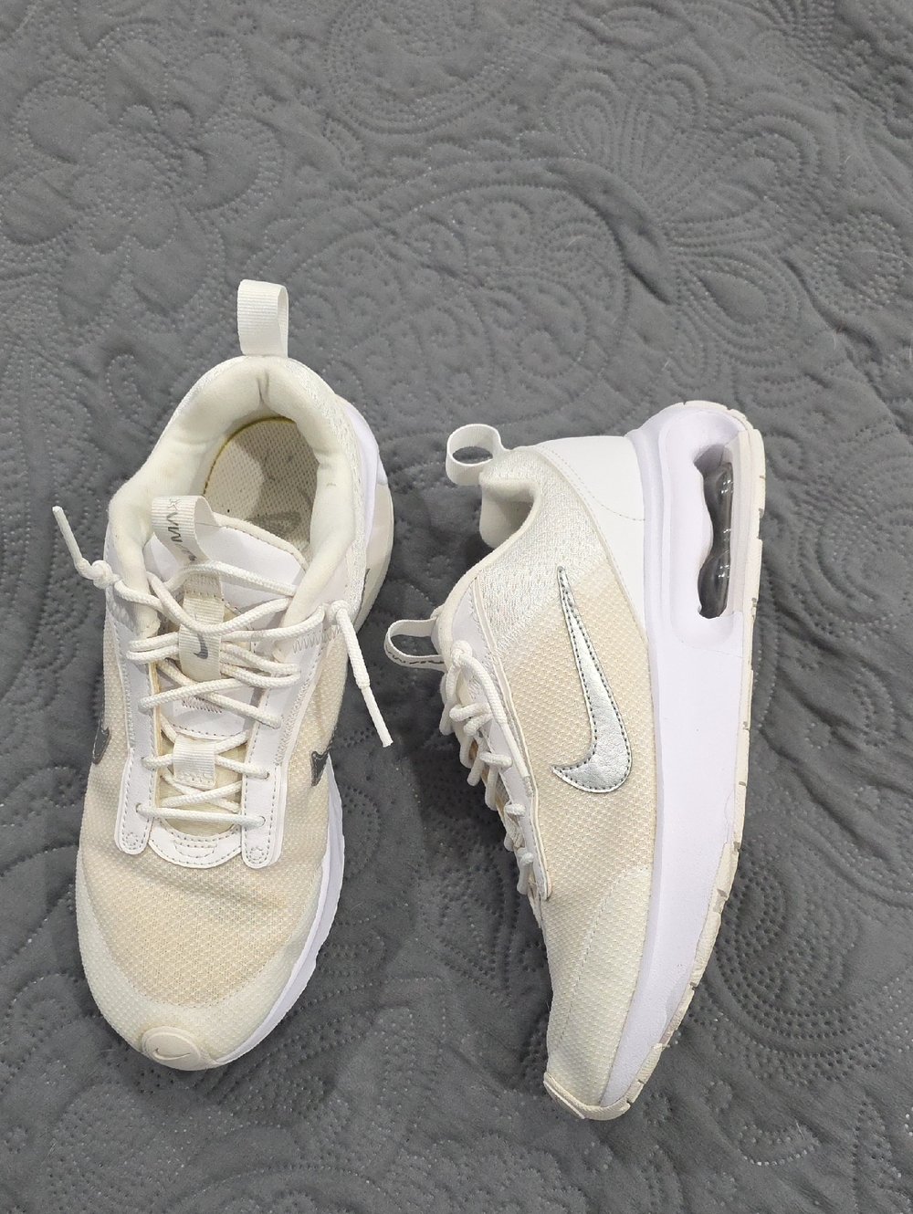 Nike Women’s Cream and White Athletic Sneakers with Silver Swoosh Accent